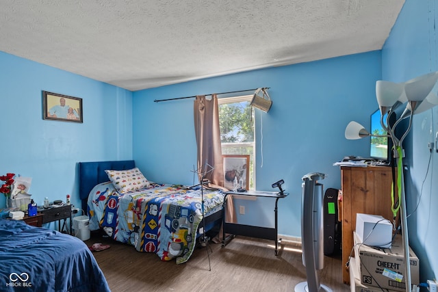 9125 Timpani Way, Indianapolis, IN 46231 - bedroom featuring wood finished floors and a textured ceiling