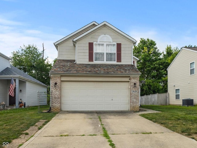 9125 Timpani Way, Indianapolis, IN 46231 - traditional home featuring brick siding, an attached garage, and driveway