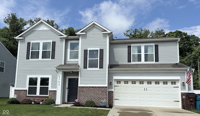 5702 Deer Valley Ct, Columbus, IN 47201 - view of front of property featuring concrete driveway, an attached garage, and brick siding