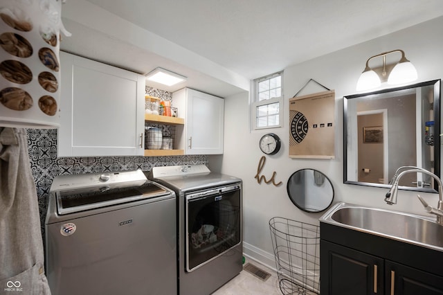 22 N Bolton Ave, Indianapolis, IN 46219 - laundry room with independent washer and dryer, cabinet space, and baseboards