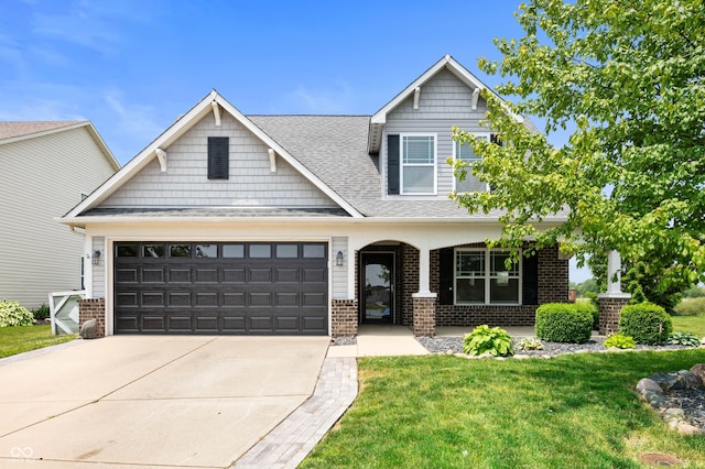 1412 Huntzinger Blvd, Pendleton, IN 46064 - craftsman inspired home with a porch, brick siding, a front yard, and driveway