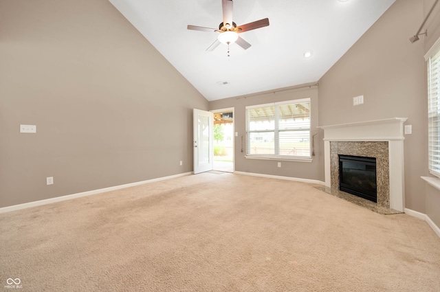 1412 Huntzinger Blvd, Pendleton, IN 46064 - unfurnished living room featuring high vaulted ceiling, baseboards, light colored carpet, a high end fireplace, and ceiling fan