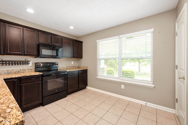 1412 Huntzinger Blvd, Pendleton, IN 46064 - kitchen with black appliances, dark brown cabinetry, baseboards, recessed lighting, and light stone countertops