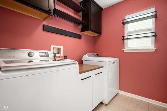 1412 Huntzinger Blvd, Pendleton, IN 46064 - washroom with cabinet space, washer and dryer, baseboards, and light tile patterned floors