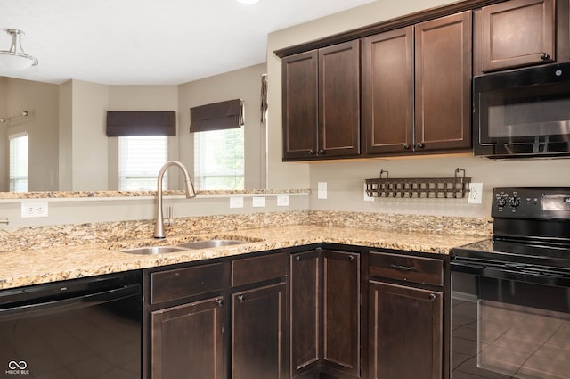 1412 Huntzinger Blvd, Pendleton, IN 46064 - kitchen with black appliances, a sink, dark brown cabinetry, light stone counters, and tile patterned flooring