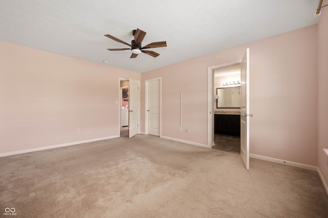 1412 Huntzinger Blvd, Pendleton, IN 46064 - unfurnished bedroom with light carpet, baseboards, ensuite bath, and a ceiling fan