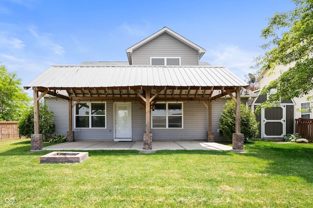 1412 Huntzinger Blvd, Pendleton, IN 46064 - back of house featuring a patio area and a fire pit