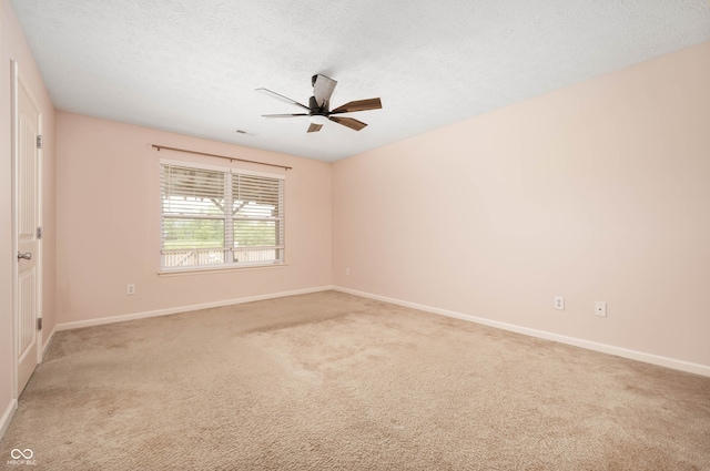 1412 Huntzinger Blvd, Pendleton, IN 46064 - unfurnished room with ceiling fan, baseboards, light carpet, and a textured ceiling