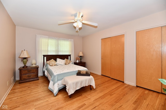1910 Ivy Dr, Anderson, IN 46011 - bedroom with light wood-style flooring, two closets, ceiling fan, and baseboards