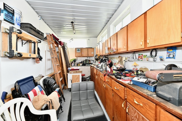 1910 Ivy Dr, Anderson, IN 46011 - kitchen featuring brown cabinetry and carpet floors