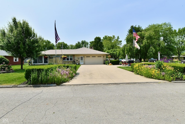1910 Ivy Dr, Anderson, IN 46011 - ranch-style house featuring an attached garage, driveway, a front lawn, and a chimney