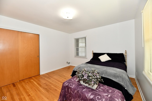1910 Ivy Dr, Anderson, IN 46011 - bedroom featuring wood finished floors, baseboards, and a closet