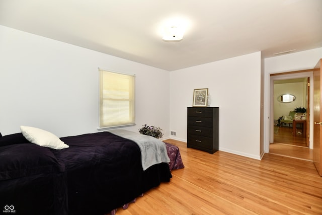 1910 Ivy Dr, Anderson, IN 46011 - bedroom with light wood-type flooring and baseboards