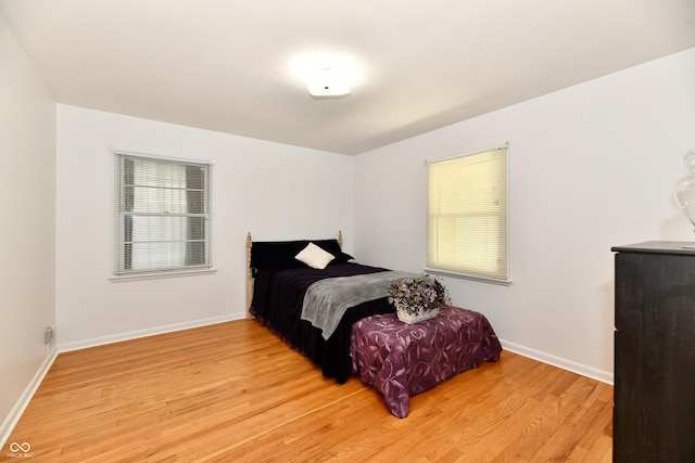 1910 Ivy Dr, Anderson, IN 46011 - bedroom featuring light wood-type flooring and baseboards