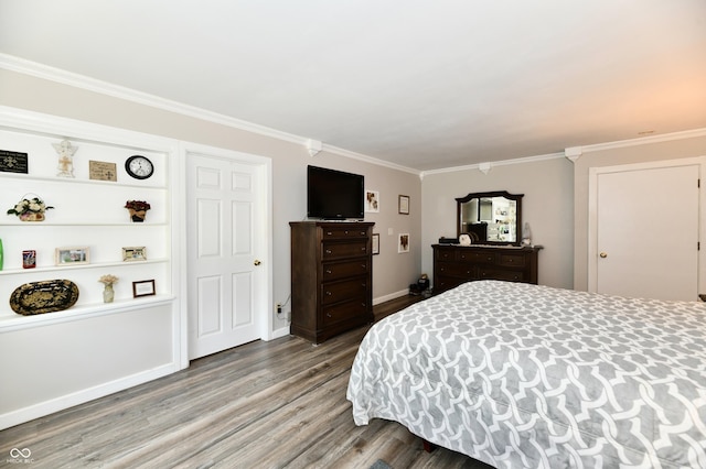 1910 Ivy Dr, Anderson, IN 46011 - bedroom featuring wood finished floors, ornamental molding, and baseboards