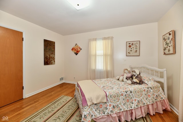 1910 Ivy Dr, Anderson, IN 46011 - bedroom with wood finished floors and baseboards