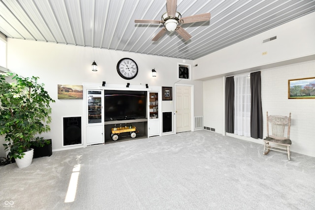 1910 Ivy Dr, Anderson, IN 46011 - unfurnished living room featuring carpet flooring and a ceiling fan