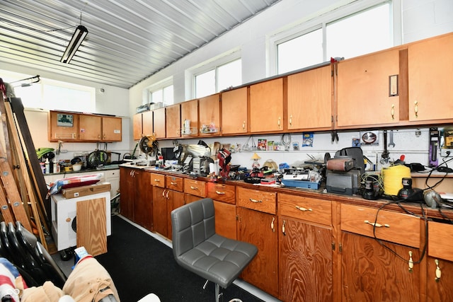 1910 Ivy Dr, Anderson, IN 46011 - kitchen featuring brown cabinetry and dark countertops