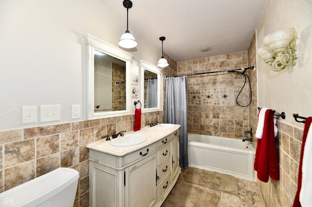 1910 Ivy Dr, Anderson, IN 46011 - full bath with tile walls, double vanity, shower / tub combo, and toilet