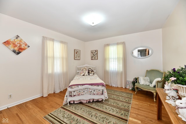 1910 Ivy Dr, Anderson, IN 46011 - bedroom with light wood-style flooring and baseboards