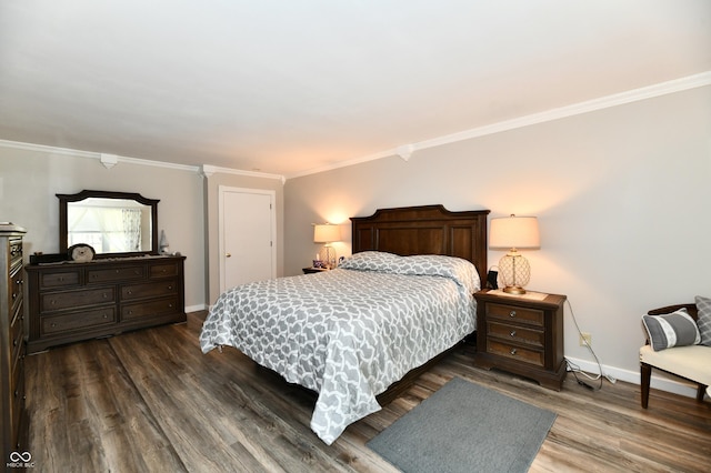 1910 Ivy Dr, Anderson, IN 46011 - bedroom featuring crown molding, dark wood-style flooring, and baseboards