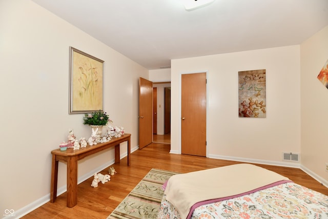1910 Ivy Dr, Anderson, IN 46011 - bedroom with light wood-type flooring and baseboards