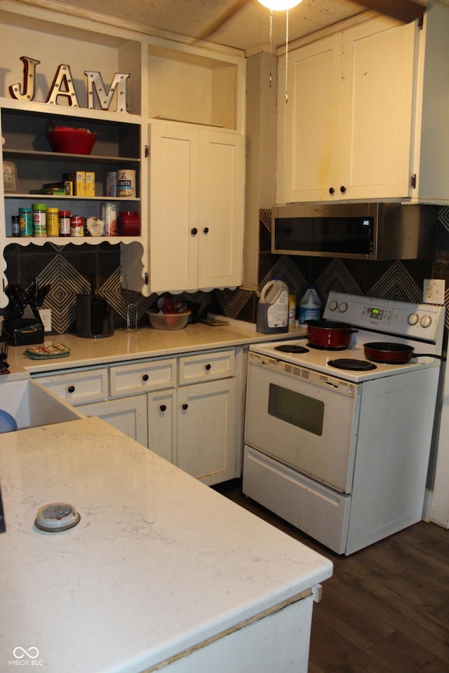 2232 Fairview St, Anderson, IN 46016 - kitchen with white electric range oven, white cabinetry, light countertops, stainless steel microwave, and open shelves