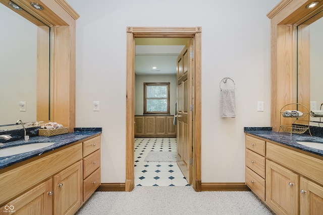815 Copperfield Ln, Danville, IN 46122 - full bath featuring two vanities and tile patterned floors