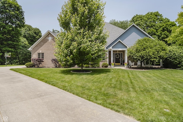 815 Copperfield Ln, Danville, IN 46122 - obstructed view of property with brick siding and a front lawn