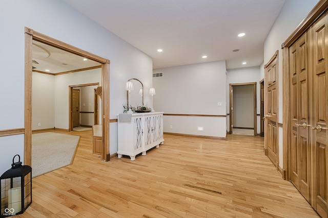 815 Copperfield Ln, Danville, IN 46122 - hallway with light wood-type flooring, recessed lighting, and ornamental molding