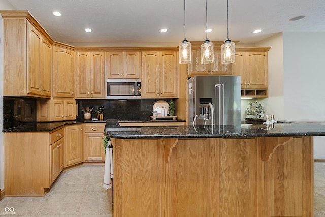 815 Copperfield Ln, Danville, IN 46122 - kitchen featuring appliances with stainless steel finishes, a center island with sink, light brown cabinetry, decorative backsplash, and recessed lighting