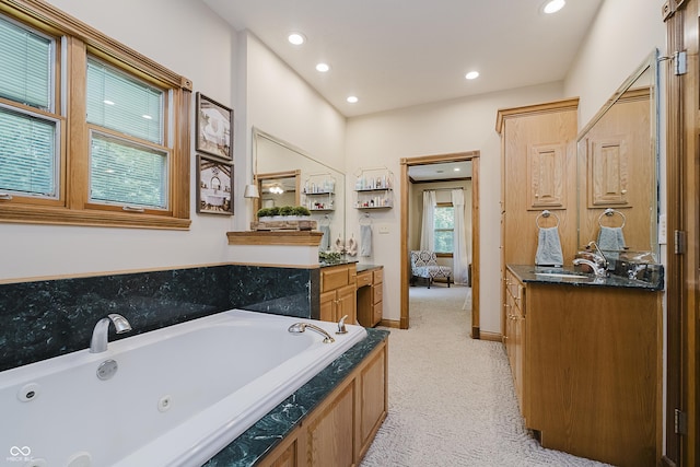 815 Copperfield Ln, Danville, IN 46122 - full bathroom with vanity, connected bathroom, a tub with jets, and recessed lighting