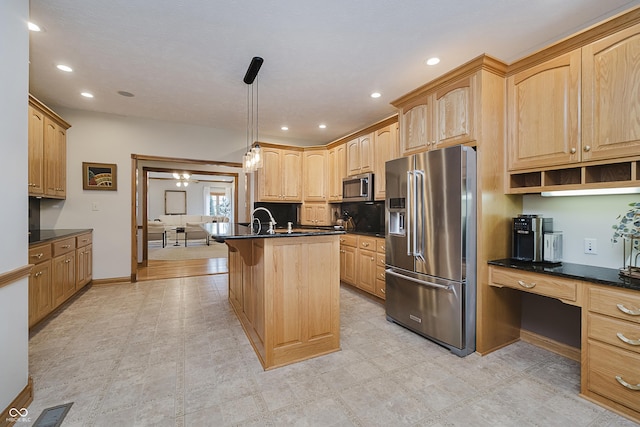 815 Copperfield Ln, Danville, IN 46122 - kitchen featuring stainless steel appliances, dark countertops, built in study area, a kitchen breakfast bar, and recessed lighting