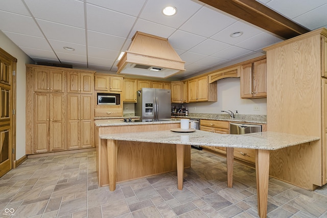 815 Copperfield Ln, Danville, IN 46122 - kitchen with appliances with stainless steel finishes, a kitchen island, light stone countertops, a kitchen bar, and recessed lighting