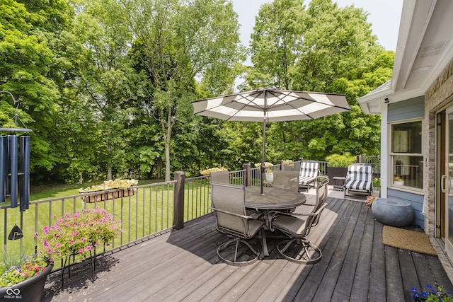 815 Copperfield Ln, Danville, IN 46122 - deck featuring outdoor dining area, a lawn, and view of wooded area