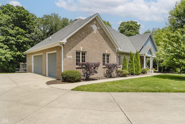 815 Copperfield Ln, Danville, IN 46122 - view of front facade featuring brick siding, concrete driveway, roof with shingles, and a front lawn