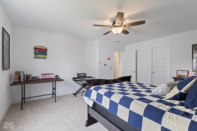 bedroom with light carpet, baseboards, and ceiling fan