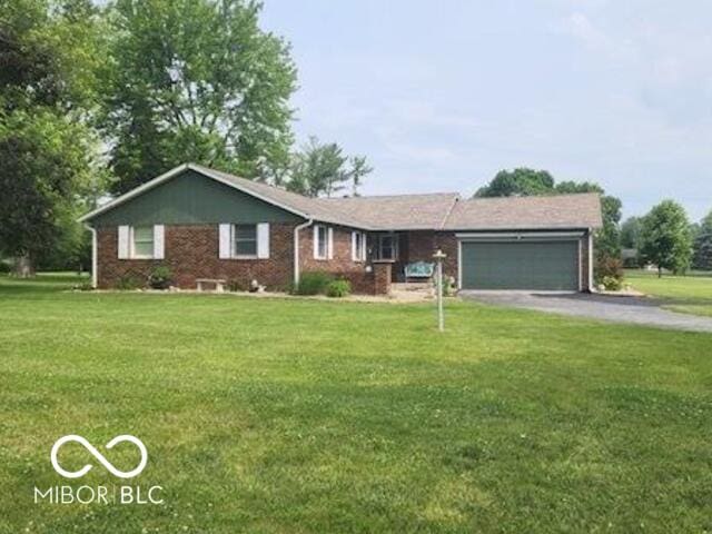 7870 E County Road 150 S, Avon, IN 46123 - ranch-style house with an attached garage, a front lawn, driveway, and brick siding