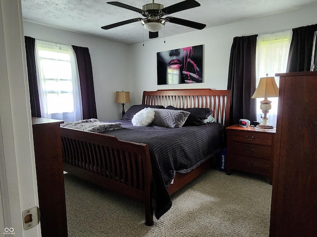 7870 E County Road 150 S, Avon, IN 46123 - bedroom featuring multiple windows, carpet floors, a ceiling fan, and a textured ceiling