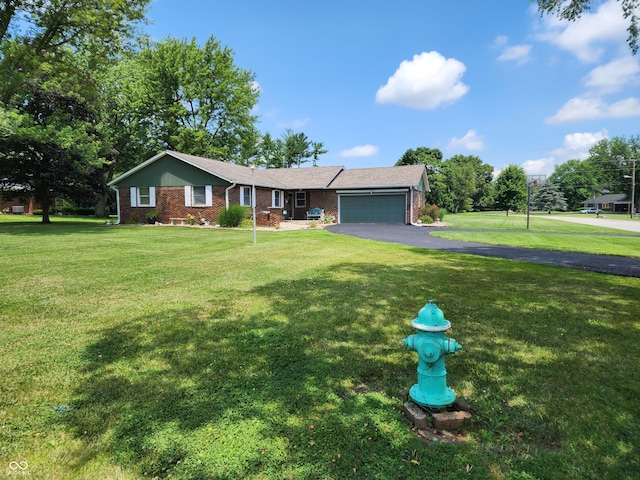 7870 E County Road 150 S, Avon, IN 46123 - single story home with asphalt driveway, a front yard, a garage, and brick siding
