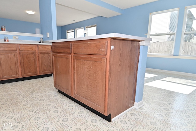 9237 Ogden Dunes Ct, Camby, IN 46113 - kitchen featuring light countertops and brown cabinets