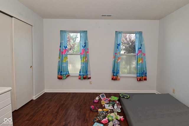 9237 Ogden Dunes Ct, Camby, IN 46113 - unfurnished bedroom featuring wood finished floors, multiple windows, and a closet