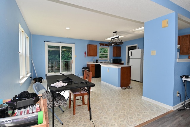 9237 Ogden Dunes Ct, Camby, IN 46113 - dining room featuring baseboards and light wood-style floors