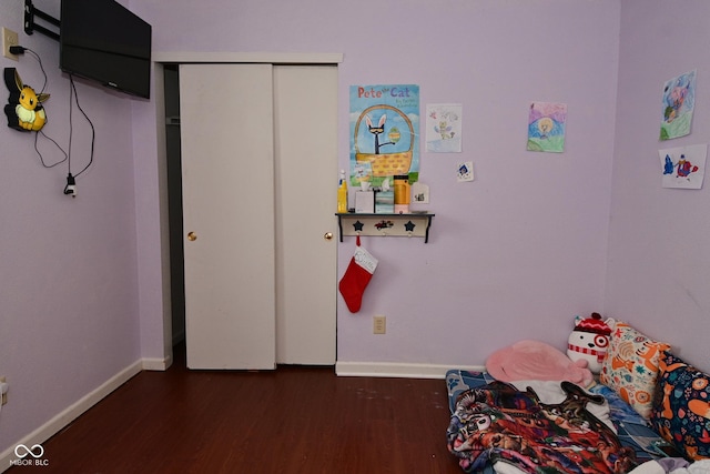9237 Ogden Dunes Ct, Camby, IN 46113 - unfurnished bedroom with dark wood-type flooring and a closet