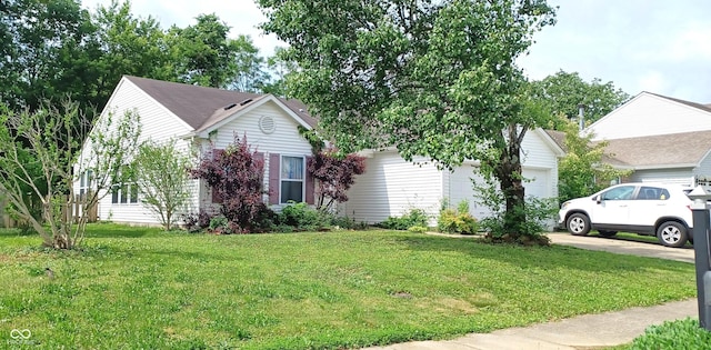 9237 Ogden Dunes Ct, Camby, IN 46113 - view of front of house featuring a front lawn, an attached garage, and driveway