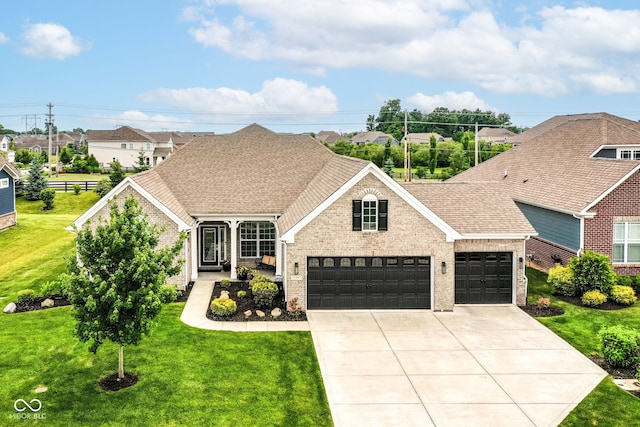 15097 Thoroughbred Dr, Fishers, IN 46040 - traditional-style home with concrete driveway, brick siding, an attached garage, and a front lawn