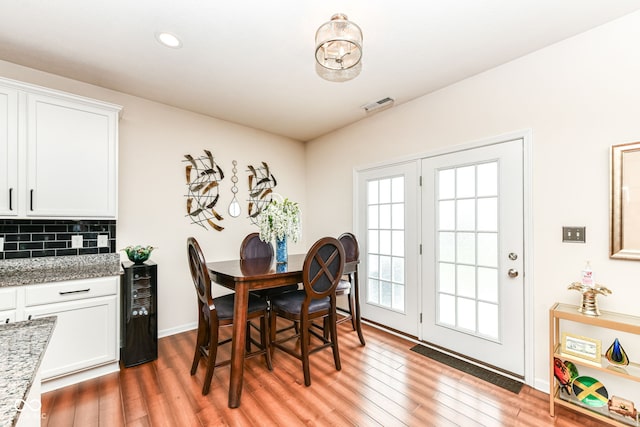 15097 Thoroughbred Dr, Fishers, IN 46040 - dining room with light wood-type flooring, beverage cooler, and recessed lighting