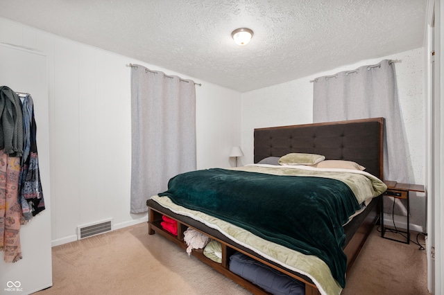 6640 E Washington St, Indianapolis, IN 46219 - bedroom featuring carpet floors, a textured ceiling, and baseboards
