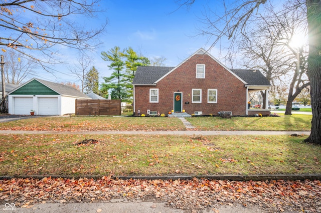 6640 E Washington St, Indianapolis, IN 46219 - view of front of house with brick siding and a detached garage