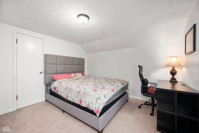 6640 E Washington St, Indianapolis, IN 46219 - carpeted bedroom featuring a textured ceiling, lofted ceiling, and a desk